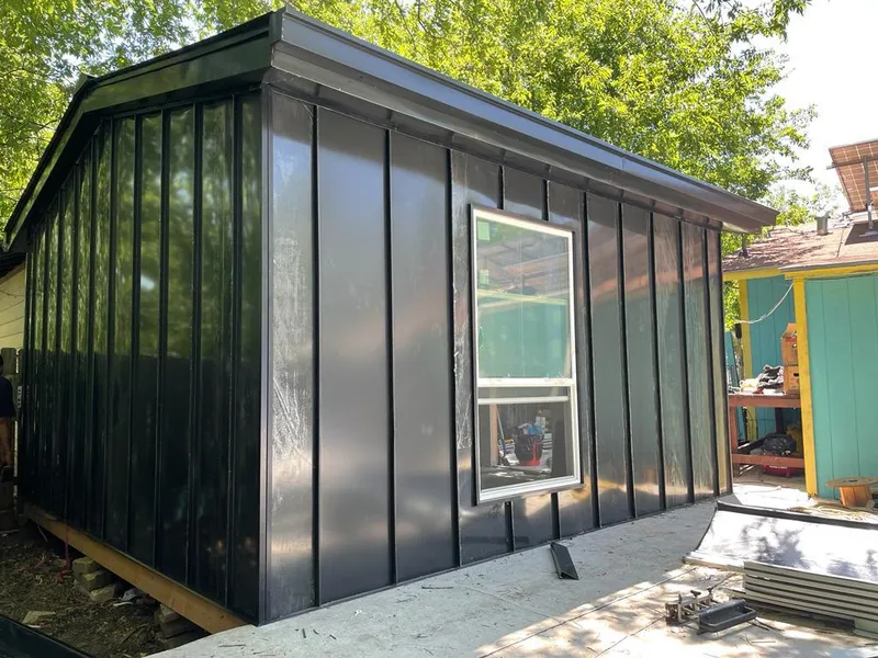 Black standing seam metal wall panels for Metal Roof Installation in Byron